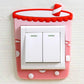 Red storefront-themed decorative double light switch cover sticker with awning and buttons