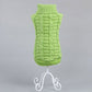 Green sleeveless turtleneck-style dog sweater with ribbed collar and hem.