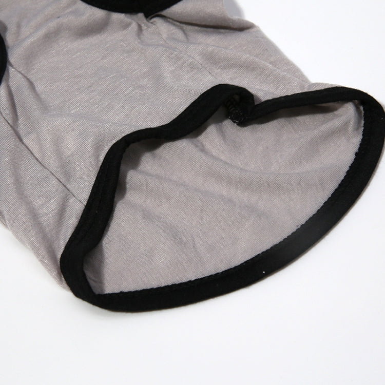 Light gray pet vest with black edging around neckline and arm openings