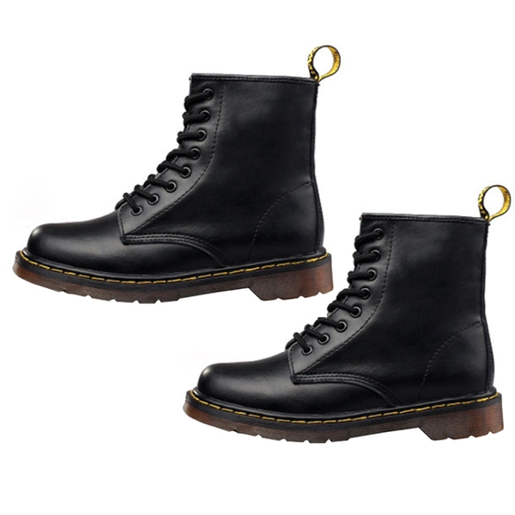 Two black lace-up ankle boots with contrast stitching and gold pull loops