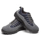 Gray and navy lace-up safety shoes shown front and side, with chunky tread sole