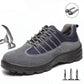 Gray and navy lace-up safety shoe with padded collar and stitched overlay panels