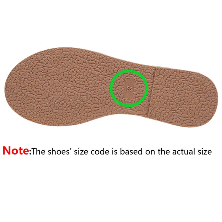 Brown textured outsole with size 37 mark for wedge shoes