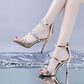 Champagne peep-toe stiletto sandals with star embellishments and ankle straps