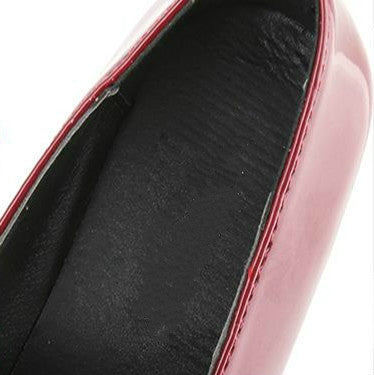 Black inner lining with red-trimmed border around shoe collar