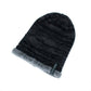 Black ribbed knit winter beanie with soft gray faux-fur cuff and small logo patch