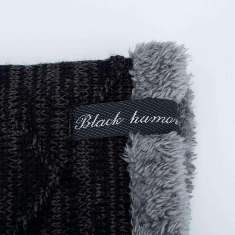 Gray and black knit beanie cuff with stitched logo label on faux-fur trim