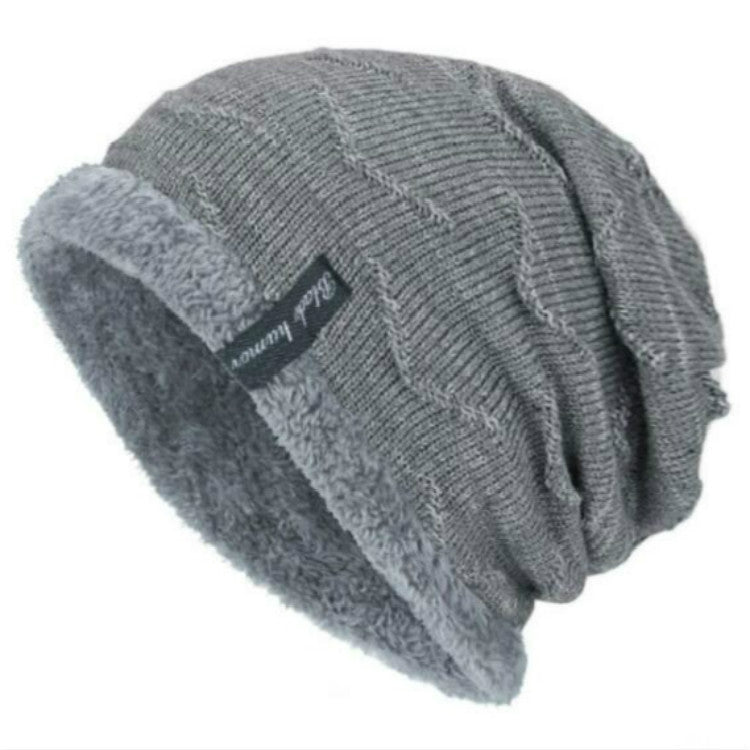 Gray ribbed knit winter beanie with soft gray faux-fur cuff and front logo patch