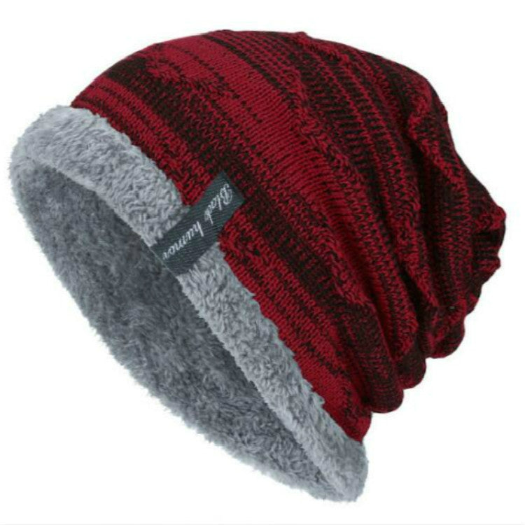 Red ribbed knit winter beanie with soft gray faux-fur cuff and front logo patch