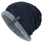 Navy knit beanie hat with gray fleece lining and cuff