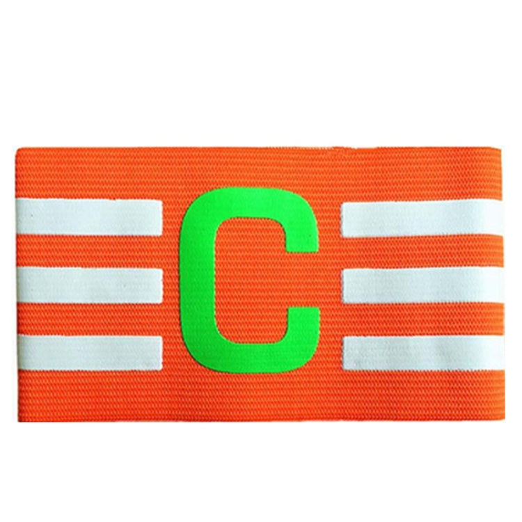 Orange captain armband close-up with green C logo and white stripe details
