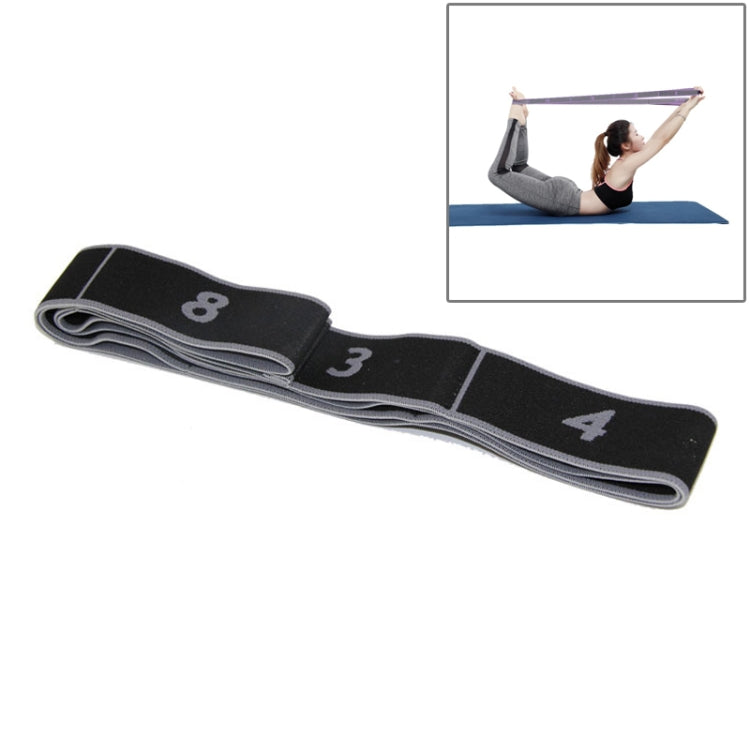 Resistance stretch band in black with gray edging and strength marks 8, 3, and 4