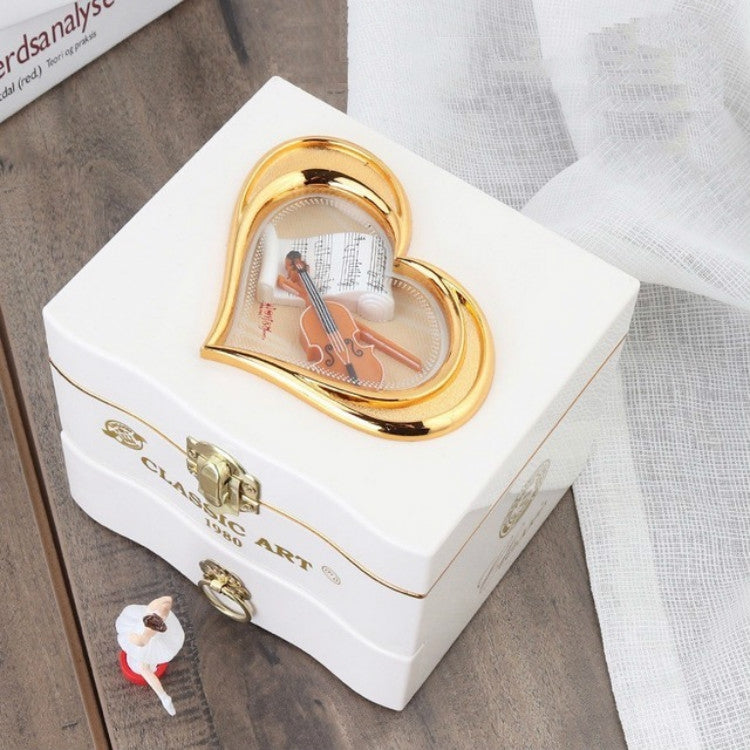 White heart-window music box with gold heart frame and dancing girl mechanism inside