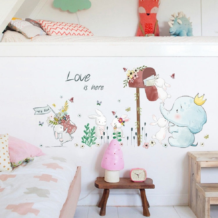 Kids wall sticker set with “Love is here” lettering, elephant, bunnies, and flowers