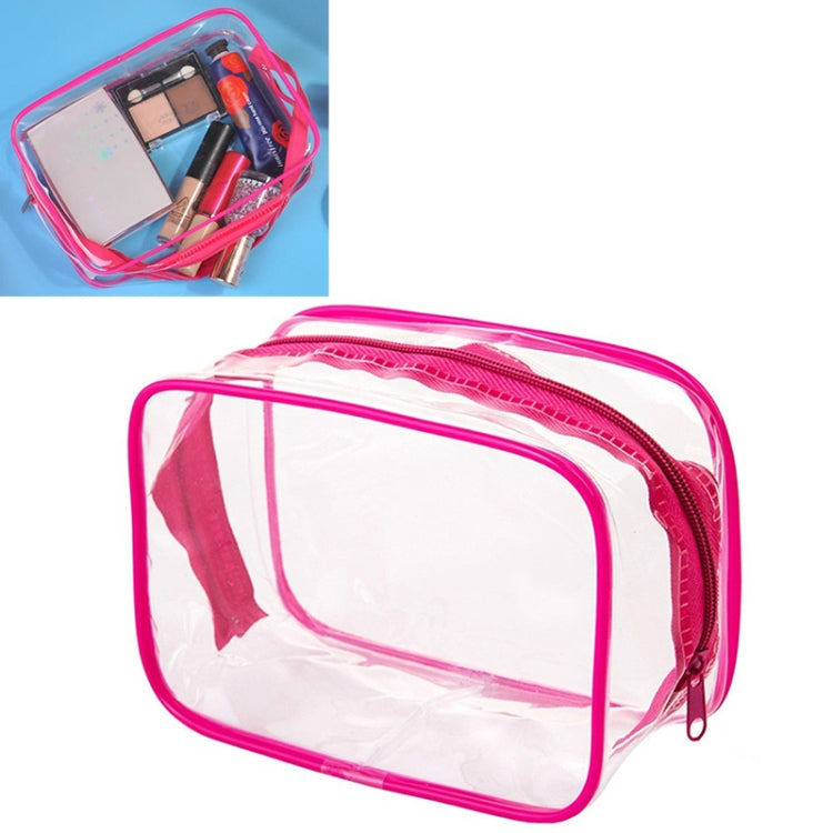 Transparent PVC makeup storage bag with pink zipper and clear front, pink carry handle.