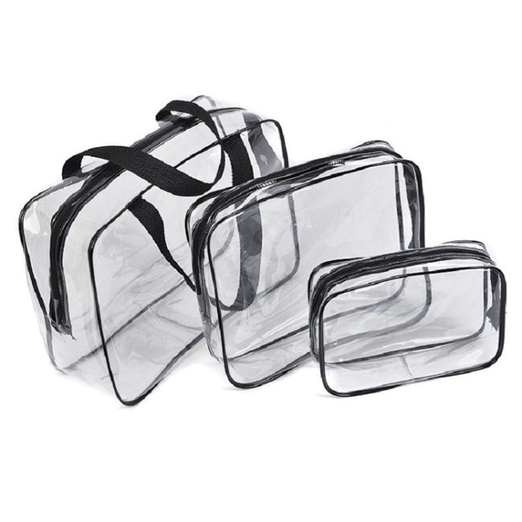 Set of transparent PVC makeup storage bags with black trim and zippers, stacked.