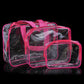 Set of transparent PVC makeup storage bags with pink trim and zippers, stacked.