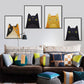 Set of framed cat canvas prints on a wall, featuring black and yellow cat faces