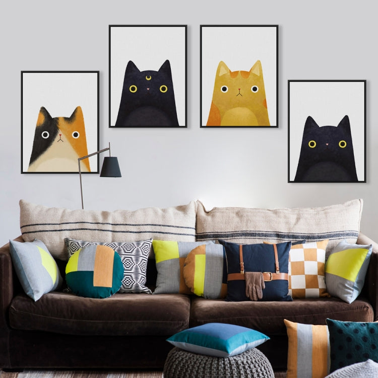 Set of framed cat canvas prints on a wall, featuring black and yellow cat faces