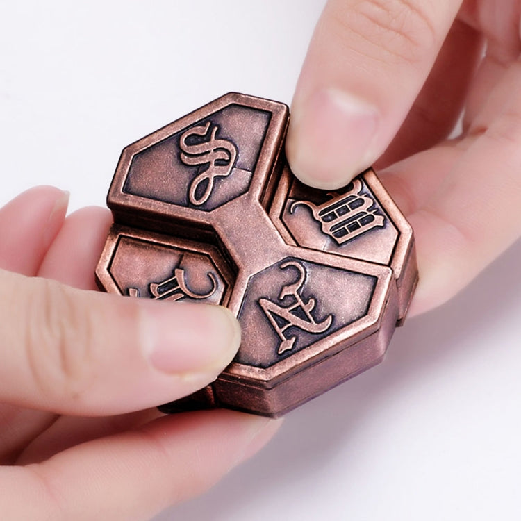 Bronze-tone metal puzzle lock box held in hands, showing engraved panel details
