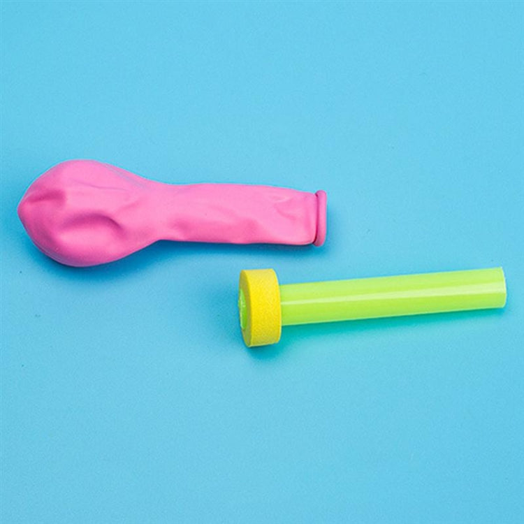 Balloon recoil parts: pink balloon sleeve and lime green launcher tube