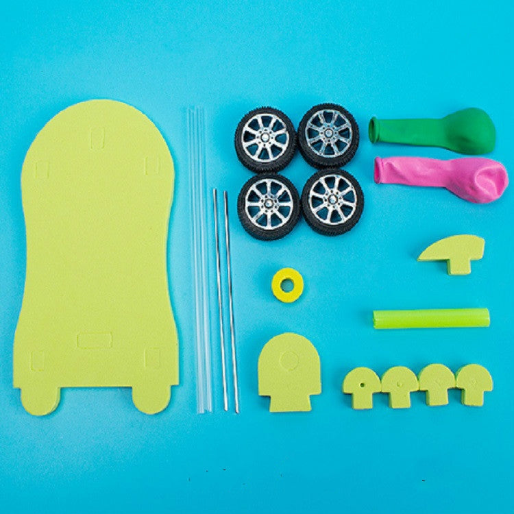 Balloon recoil car DIY kit parts: wheels, tubes, balloon sleeve, and plastic pieces
