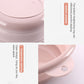 Pink folding washbasin lid edge with circular hanging hole and integrated handle.