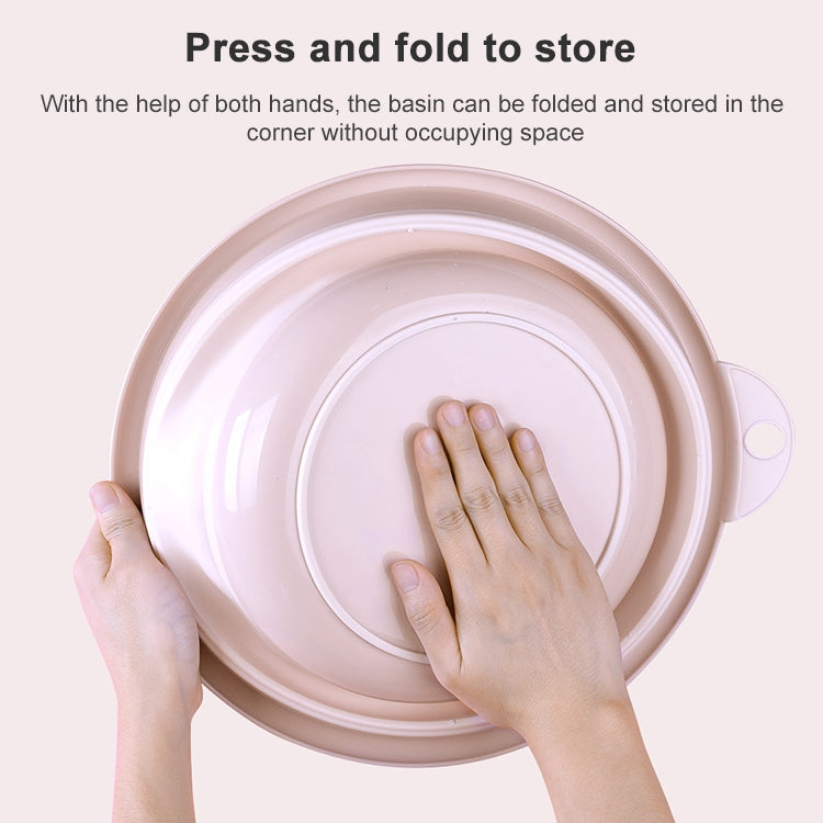Pink folding washbasin being pressed closed, round tub with side handle.