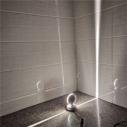 White LED semicircle wall spotlight emitting cool white light from dome head