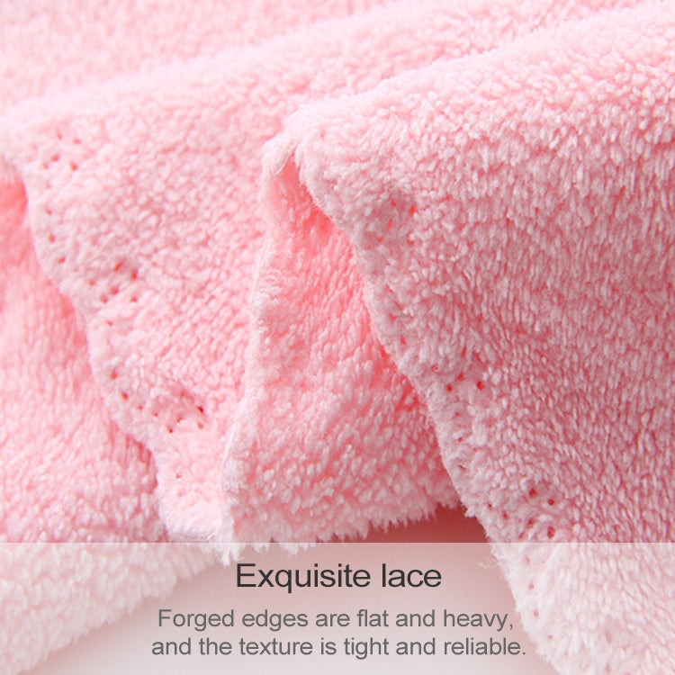 Pink coral fleece bath towel, close-up of fluffy terry pile and wavy edge