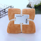 Brown bath towel set, folded with wavy edge and center tie strap