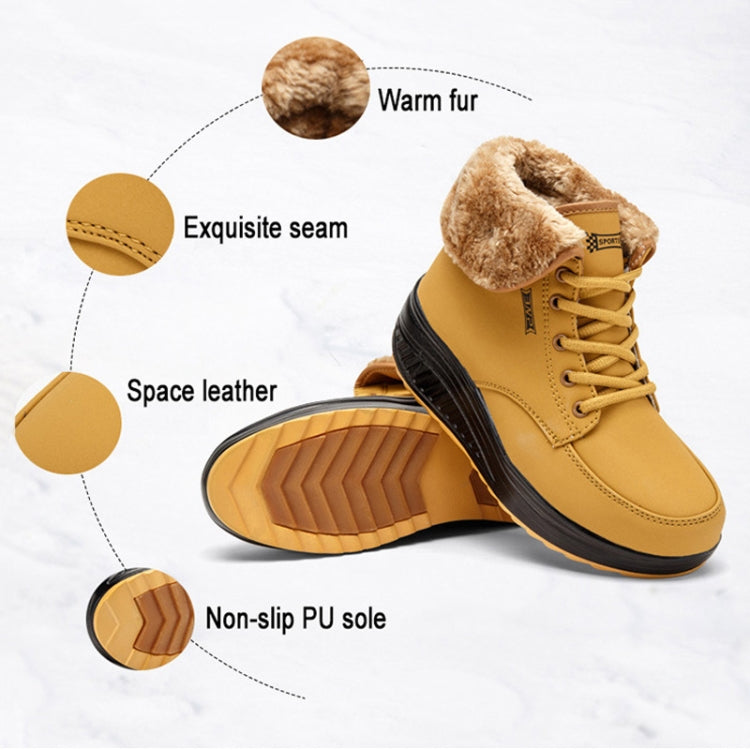 Yellow lace-up winter boots with faux fur collar and rugged tread sole