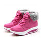 Women’s lace-up snow wedge boots in hot pink with plush faux-fur collar