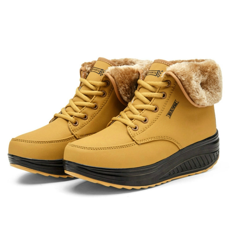 Women’s lace-up snow wedge boots in mustard yellow with front lace eyelets