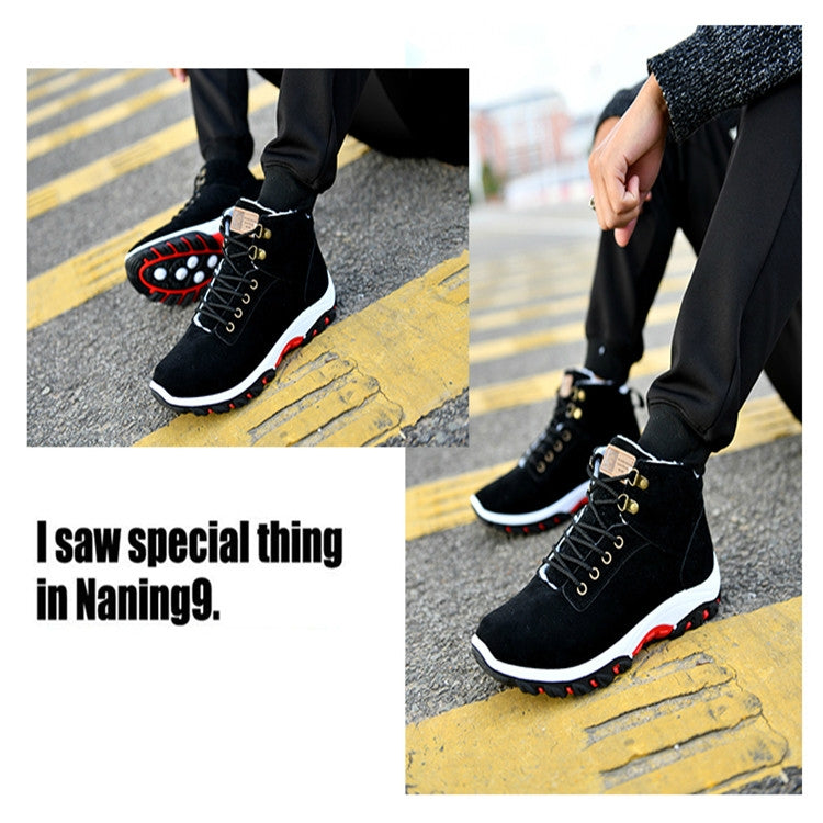Black men's snow boots with lace-up front, white midsole, and red outsole tread