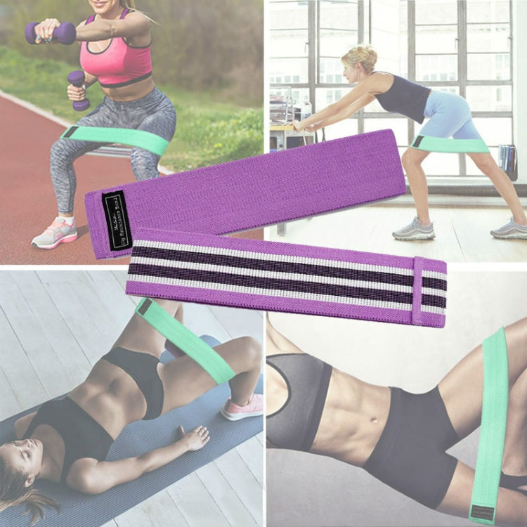 Purple yoga loop resistance band with black grip stripes and label tag
