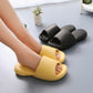 Men's yellow and black plastic slide slippers on feet, textured footbed