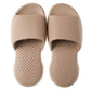 Pair of tan men's plastic slide slippers with textured sole and open toe