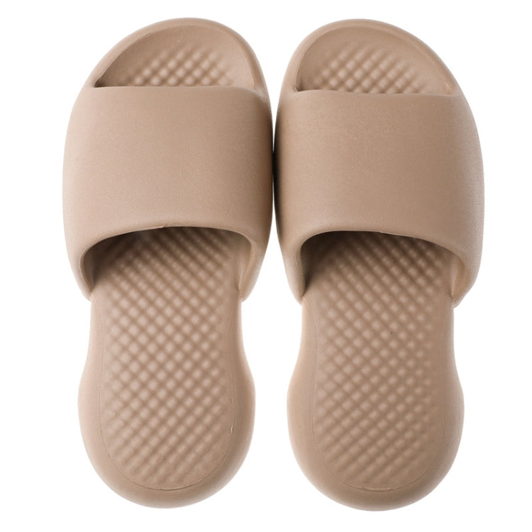 Men's tan plastic bath slippers with textured insole and open toe design