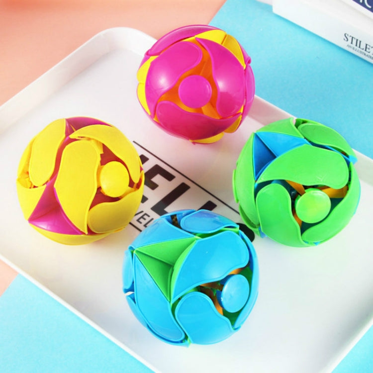 Color-changing magic throwing ball with yellow, pink, and green layered shell