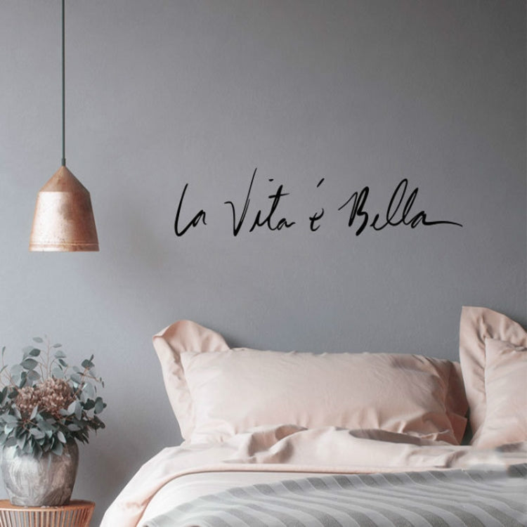 Black cursive wall sticker decal reading 'La Vita e Bella'.