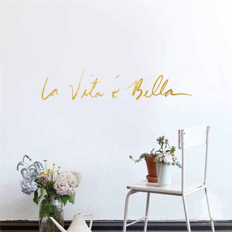 Gold cursive wall sticker decal reading 'La Vita e Bella'.