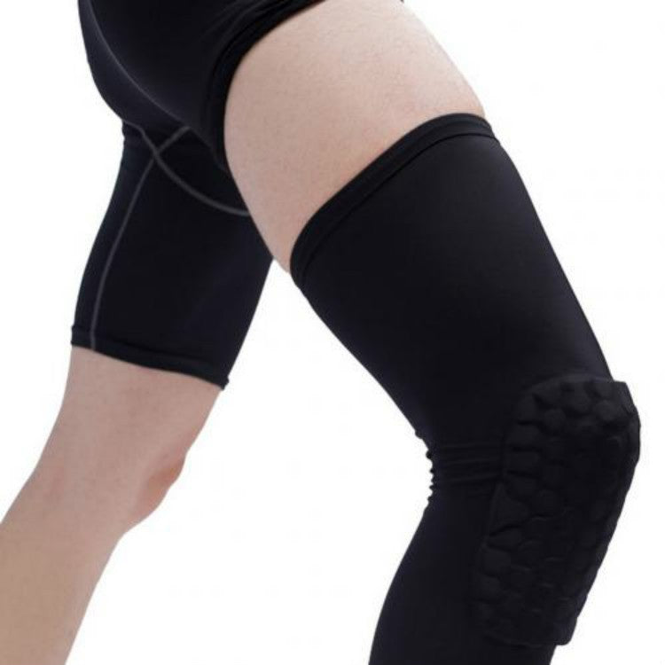 Black long knee pad sleeve on leg with raised honeycomb impact guard and elastic cuff