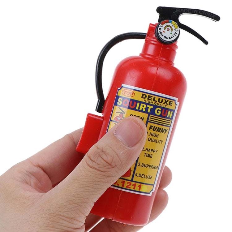 Red plastic toy fire extinguisher squirt gun with front label and black nozzle