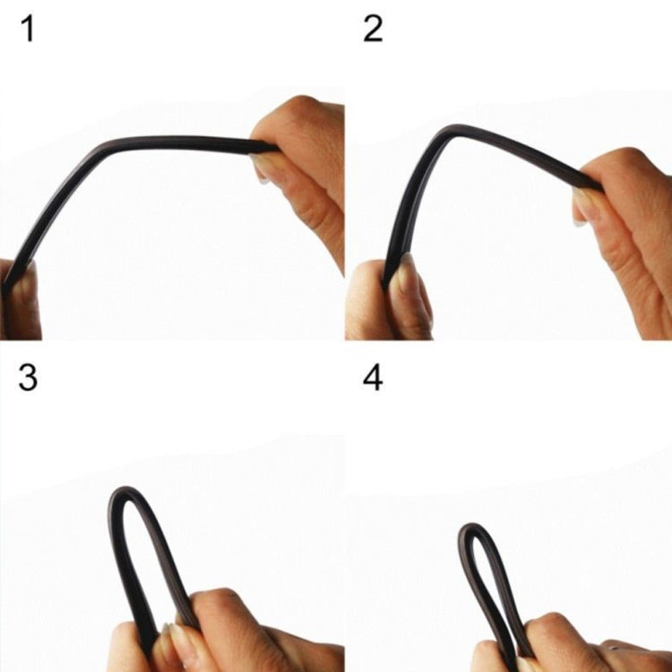 Hand holding a black mesh frame edge for a magnetic insect screen curtain