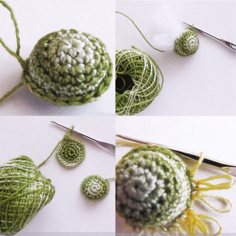Small crocheted green yarn ball with yarn skeins and crochet needle