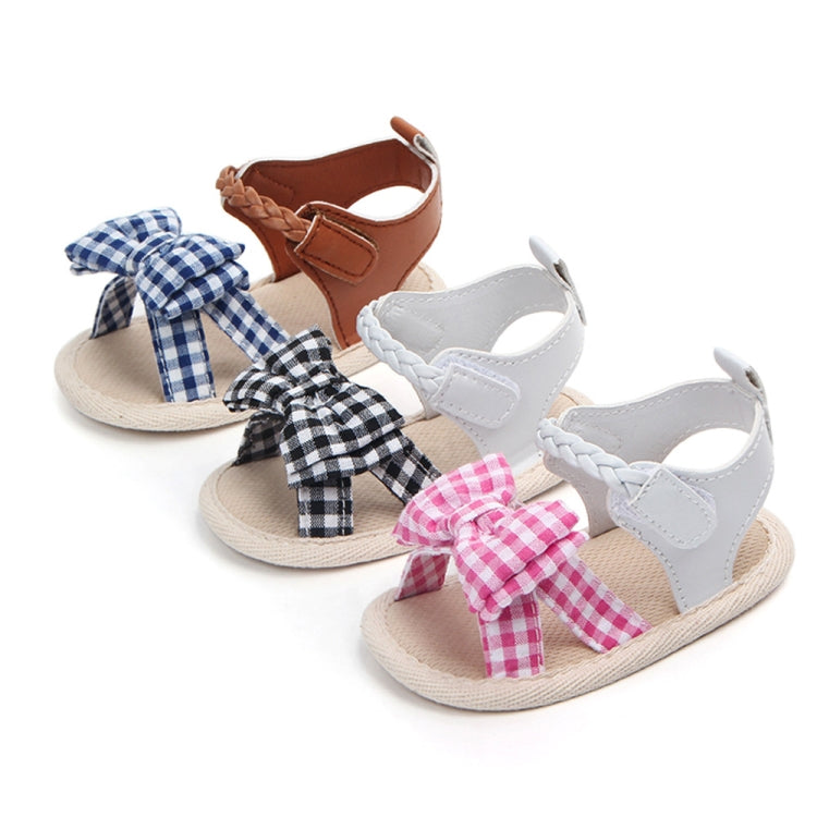 Pair of baby sandals with gingham bows in white, brown, and pink plaid accents