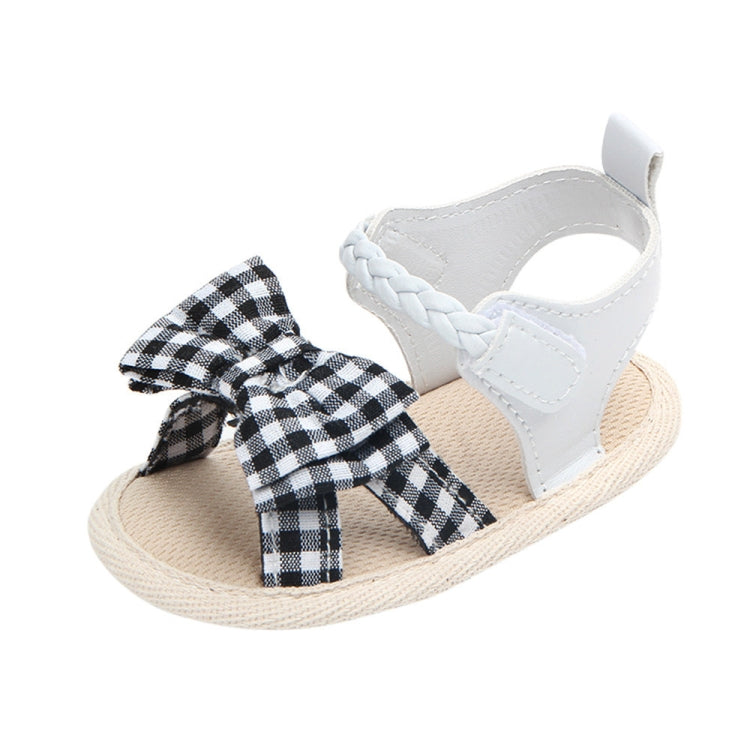 White baby sandals with braided strap and black plaid bow, soft anti-slip sole