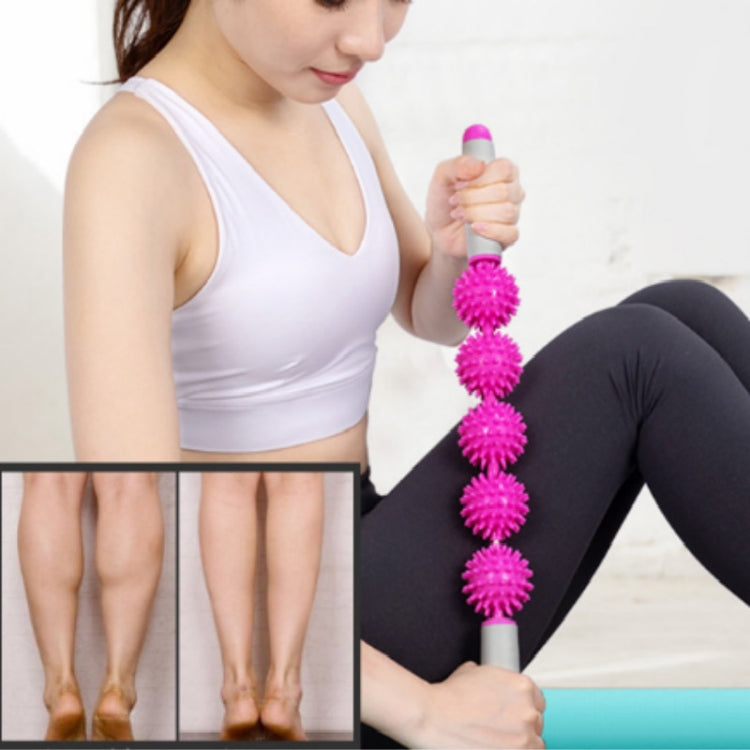 Pink hedgehog ball massage roller stick used on back while seated