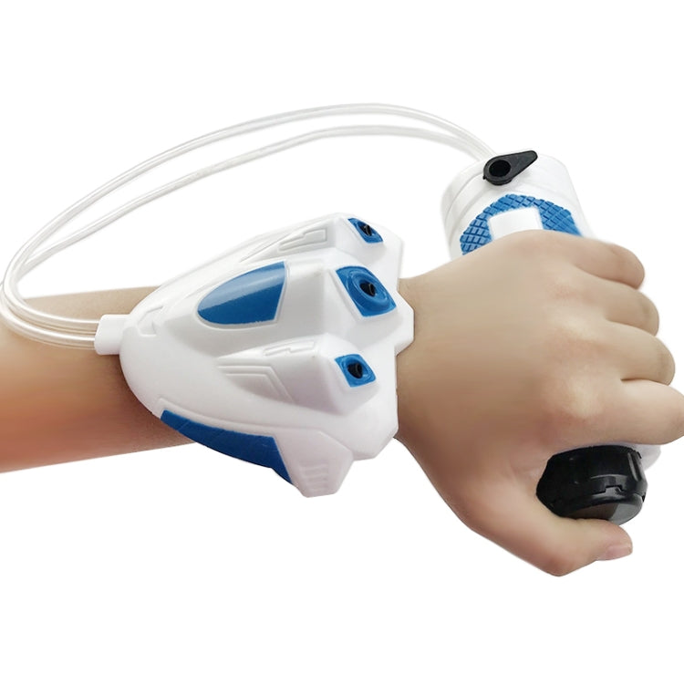 Blue-and-white wrist water gun with clear hose, held in a child’s hand